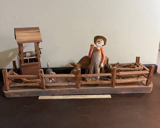 H49 - $100. Hand carved hand painted wooden tobacco farmer. Signed Measures 28" x 8.5" x 12" tall.