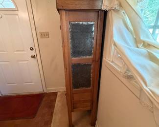 H24 - $350. Oak Pie Safe Cabinet with Punched Tin Doors. Measures 35" x 16.5" x 63"T.
