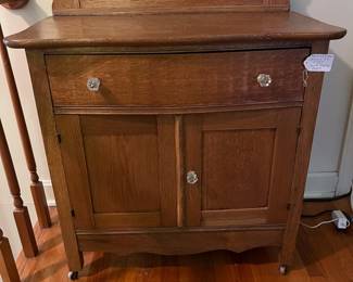 H13 - $95. Antique Oak Washstand with a High-Back Harp frame. Measures 29.5" x 17" x 73"T, floor to dresser top- 29.25"T. Very good condition.
