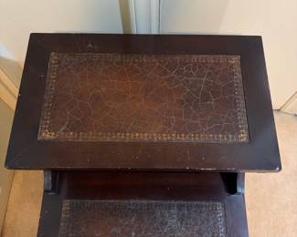 H32 - $30. Side table with leather top by The Rothrock Line from Thomasville NC. Measures 19" x 25" x 25"T, lower table 16.5"T.