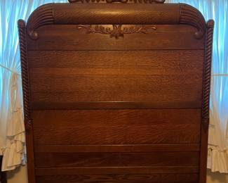 H9 - $150. Antique High Back Tiger Oak Double Bed. Measures 57.5" x 81" x 78"T, footboard 35.75"T. Very good condition - foot board has a weak spot on the top that should be an easy repair.