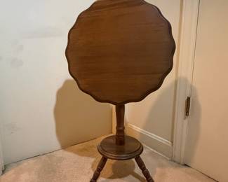 H39 - $45. Tilt top pie crust table. Measures 17" x 25"T.
