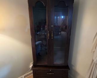 H41 - $100. Glass front gun cabinet with glass shelves added for display cabinet. Measures 31.5" x 12" x 70.5"T. No key.
