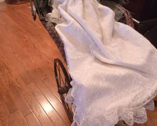 Ceramic dolls in antique carriage