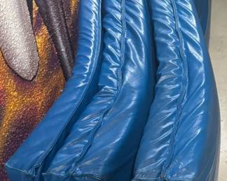 High-Impact Tri-Fold Gymnastic & Plyo Tumbling Mat high-impact Tri-Fold Gym Mat. Wrapped in thick, puncture-resistant, wipe-clean marine-grade blue vinyl, this heavy-density foam mat features secure hook-and-loop fastening strips on the ends, allowing for seamless expansion with additional units or secure placement during high-intensity training.