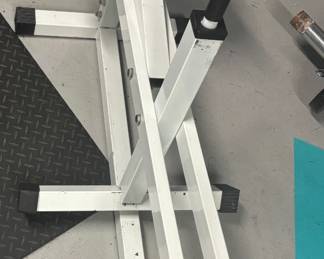 Heavy-Duty Seated Calf Raise Machine designed for absolute lower-body isolation. Features an ultra-stable, cross-braced white steel frame with adjustable knee padding and dual Olympic plate storage pegs. This specialized, heavy-gauge steel asset delivers a smooth, bio-mechanically precise pivot point perfect for a high-tier personal training studio or dedicated home gym.
