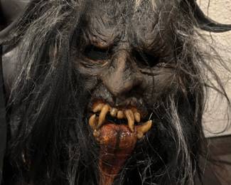 Ghoulish Productions "Wendigo" Deluxe Mythological Mask A masterpiece of folklore horror. handcrafted and painted by master artisans. Featuring terrifying dual-layered predatory teeth, hollow soulless eyes, and meticulous multi-textured synthetic hair. It stands as an investment-grade piece for mask collectors, professional scare actors, and dark-gallery displays.