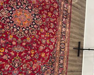 Elegant Persian Kashan Hand-Knotted Medallion Rug Masterclass in classical Persian design. an incredibly dense, curvilinear floral composition centered around a spectacular multi-lobed medallion. Woven in a rich imperial palette of ruby red, indigo blue, burnt orange, and soft ivory, this investment-grade textile brings instant warmth, luxury, and historic gravity to any grand living or dining space.