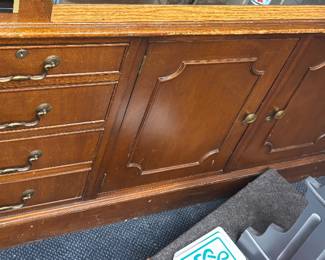 Traditional Double-Pedestal Credenza / Base Unit Expansive administrative or dining sideboard featuring traditional raised panel woodwork. Balanced configuration with integrated lockable drawer sets and large storage bays. Excellent structural integrity with minor surface wear, ideal for high-end workspace storage.