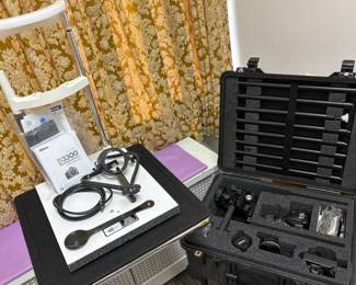 Pesek IrisCam MultiFlex Professional Clinical Iridology Imaging Suite With specialized ophthalmic chin rest, Nikon D3300 DSLR camera assembly, and Pelican flight case shown Designed by world-renowned expert Dr. David J. Pesek, the Pesek IrisCam MultiFlex is the benchmark system for high-resolution iris and sclera photography. Includes an adjustable lateral/medial fiber-optic lighting alignment chin-rest architecture, paired with an optimized Nikon D3300 24.2MP DSLR camera system, specialized macro lens filters, and manual positioning rigs, all organized in a heavy-duty, watertight, airline-friendly custom wheeled Pelican travel case.