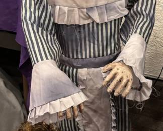 Deluxe Ventriloquist "Living Doll" Animatronic / Lifesize Static Duo Pure gothic sophistication. This lifesize Victorian-era ventriloquist "living doll" duo features immaculate striped period attire, lace trim accents, and jaw-dropping cracked-porcelain facial finishes. Their piercing, lifelike eyes deliver a spine-chilling gaze that commands any room. Far beyond standard holiday decorations, this is a premium set designed for serious dark-art collectors and boutique horror exhibits