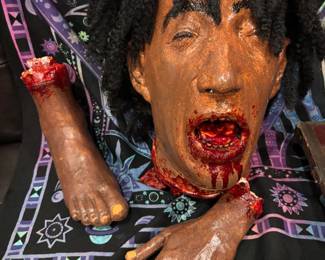 Hyper-Realistic Severed Head & Limbs FX Gore Set Uncompromising cinematic realism. This premium special-effects gore kit includes a hyper-detailed severed head featuring hand-laid textured hair, deep visceral mouth cavities, and anatomically precise severed hand and foot elements. Finished with multi-layered, non-fading archival gloss blood to maintain a freshly-cut wet look indefinitely. Ideal for elite prop collectors and high-budget horror productions.