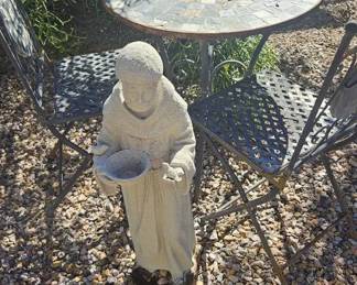 Metal and Stone Bistro Table and Monk Statue