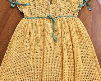 Vintage-Style Crocheted Child’s Dress ◆ Golden yellow openwork crochet ◆ Puff sleeves ◆ Green ribbon accents at sleeves and waist ◆ White button detailing