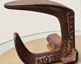 Vintage Cast-Iron Cobbler’s Shoe Last — Heavy metal shoe-repair tool marked “Alaska No. 2,” with aged patina and curved shaping surfaces.