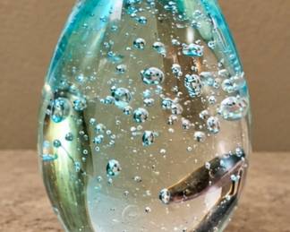Blue Bubble Glass Egg — Clear aqua-blue art glass with suspended bubbles.