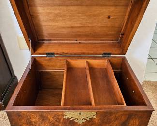 Vintage-Style Wooden Storage Chest ◆ Rich burled woodgrain finish ◆ Ornate brass-tone hardware ◆ Hinged lid ◆ Removable divided wooden tray ◆ Decorative carved base