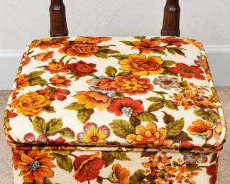 Vintage Floral Upholstered Accent Chair ◆ Colorful orange, yellow, rust, and green floral fabric ◆ Upholstered backrest and seat ◆ Dark wood frame ◆ Turned wooden legs