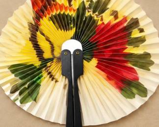 Multicolor Floral Folding Fan — Cream pleated fan with bold yellow, red, orange, and green floral design and black handle.