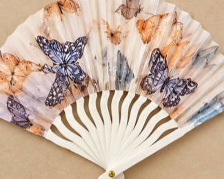 Butterfly Folding Fan — Ivory folding fan with purple, orange, and gray butterfly designs and white ribs.