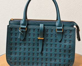 Teal Blue Structured Handbag ◆ Geometric patterned front ◆ Double handles ◆ Gold-tone hardware ◆ Top zipper closure ◆ Decorative front strap detail