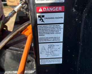 Backhoe attachment - warning-label detail