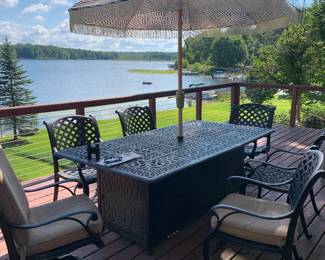 powder-coated aluminum table with 2 fire pits, 8 chairs (2 swivel), umbrella & stand