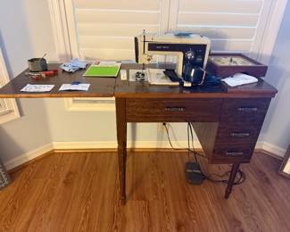 Sears Kenmore sewing machine in cabinet
