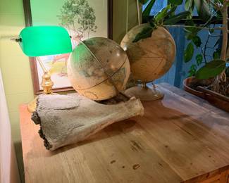 So many globes, banker’s lamp, bone incense holder, whitetail deer print 