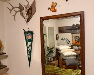 Plaster ducks, taxidermy, mirror, pennant 