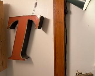 Restored outdoor letter “T” sign, large vise, green garden light, brass reading lamp