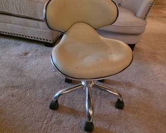 low-profile rolling salon or pedicure stool,