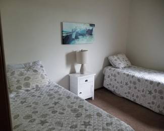 Twin beds; nightstand; table lamp