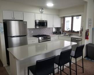 Kitchen features Frigidaire stainless steel appliance suite