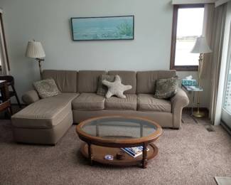 Cozy couch; coffee table; floor lamps