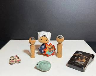 A Korean Celadon Water Dropper & Japanese Souvenirs; Kokeshi Dolls, Lotus Slippers And Lacquered Box