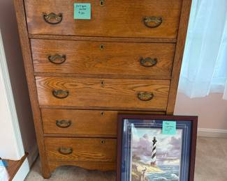 Antique dresser and commemorative lighthouse painting