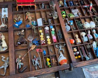 Eclectic Collection of Vintage Miniatures, Toys & Collectibles A fascinating assortment of vintage and antique miniature treasures, displayed in beautiful wooden compartmentalized printer’s trays. Collection includes miniature figurines, vintage toys, military soldiers, knights, Disney characters, porcelain figures, miniature vehicles, airplanes, trains, dice, advertising novelties, souvenir collectibles, decorative objects, and unusual curiosities. An eclectic mix of metal, wood, porcelain, ceramic, glass, and plastic pieces spanning different eras and styles. Perfect for collectors, antique enthusiasts, artists, miniature lovers, and anyone who appreciates unusual, nostalgic, and one-of-a-kind finds!