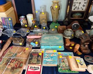 Vintage maps, bells, vases, crochet needles, dolls, carved wood booths, music vanity boxes, trinket dishes, boxes, childrens books