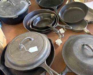 Collection of Cast Iron skillets, pans and lids