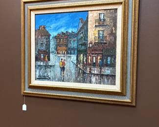 Impressionist oil painting depicting a rainy European or Parisian street scene commonly signed in the style of artists like Caroline Burnett
