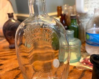Stamped "Federal Law Fprbods Sale or re-use of this Bottle D661