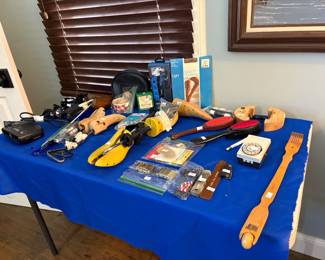Misc grooming items for shoes, link removers, clock radio etc
