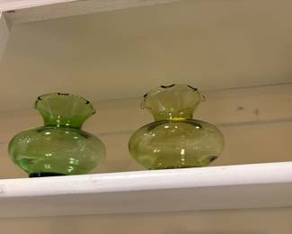 2 different colors of green glass vases