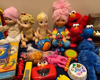 Baby Alive - Interactive baby doll made by  Hasbro around 2009Tickled Pink (Baby Brite) doll from the 1983 Hallmark and Mattel Rainbow Brite line