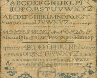 A 19th century American Needlework Sampler.  Made by "Mary Ann Agan 1823" with simple stylized vine and foliate border that contains 10 rows of alphabet above stylized floral and foliate motifs, all in Green.  Fading, some staining, and wear.  Image 17 x 16 1/4" high, within a later wood frame with some wear and losses, 18 1/2 x 17 1/2" high overall.  