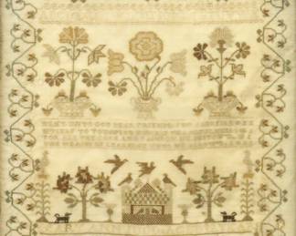 A 19th century American Needlework Sampler.  Made by "Mary Ann Judd Aged 12" with a Red, Green, and White stylized flower and vine motif that contains a single row of the alphabet above floral motifs, a religious rhyme, and stylized, dogs, birds, flowers, and an architectural structure.  Fading, light staining, and some losses.  Image 12 5/8 x 12 3/4" high, in a later wood frame with some wear, 16 3/4 x 17" high overall. 