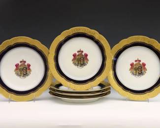 Six pieces of late 19th century E. Gallee armorial porcelain dinnerware from the service of Emperor Alexander II and Grand Duchess Yurievskaya, c. 1880.  Includes five circular plates and one low soup bowl featuring the Yurievsky Coat of Arms above a banner with Cyrillic motto "Za Veru Tsarya I Otechestva" (For Faith, Tsar and Fatherland), surrounded by Cobalt Blue borders and scalloped rims with Gilded foliate decoration.  Printed "Depot Central / E. Gallee / 43 R. Bonaparte" marks.  Soup bowl with chip to rim, minor surface wear.  10" diameter.  ESTIMATE $1,000-2,000