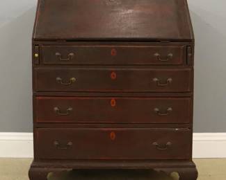 An 18th century New England slant-front desk.  Dovetailed Maple construction features a hinged slant-front top that opens to reveal a fitted interior decorated with painted stringing, over four long drawers with painted escutcheons on a bracket base with cut-out ogee feet.  Old painted finish with some wear, shrinkage, some repairs and replacements to feet, slant-front and interior, lacks one internal divider.  36 x 28 x 45 1/2" high overall.  