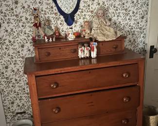 Antique Dresser and collector dolls.